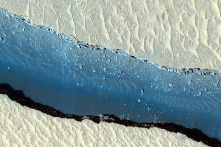 The 4 kilometer (2.5 mile) diameter crater in this image appears relatively fresh, but with little erosion or underground upheaval on Mars and no evidence of an extremely recent meteor hit, "fresh" is a relative term. 