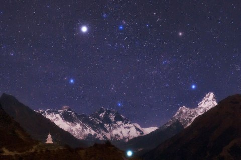 image: From left: Stars shine in the night sky above Mt. Everest, Mt. Lutse and Ama Dablam in Nepal, Sept. 7, 2011.