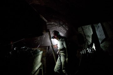 image: A worker labors to develop a new coal mine shaft in Shanxi Province, China, March 24, 2011.
