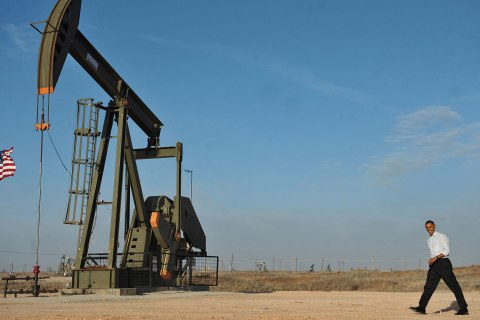 image: President Barack Obama walks past an oil rig to a stage to speaks at an oil and gas production field on federal lands near Maljamar, N.M., March 21, 2012.