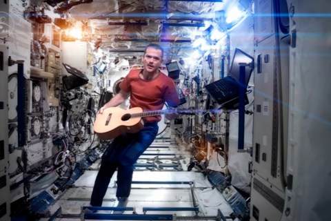 Canadian astronaut and International Space Station (ISS) Commander Chris Hadfield performs his zero-gravity version of David Bowie's hit "Space Oddity" in this video still. The video was released on YouTube on May 12, 2013.
