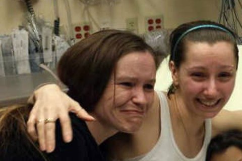 Amanda Berry, center, reunited with her sister on May 6, 2013 in Cleveland, Ohio.