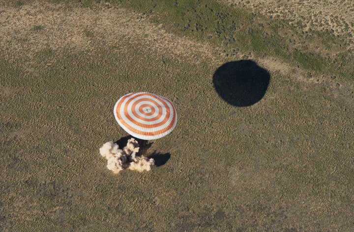 The Soyuz TMA-07M spacecraft lands with Expedition 35 Commander Chris Hadfield of the Canadian Space Agency (CSA), NASA Flight Engineer Tom Marshburn and Russian Flight Engineer Roman Romanenko of the Russian Federal Space Agency (Roscosmos) in a remote area near the town of Zhezkazgan, Kazakhstan, on May 14, 2013.