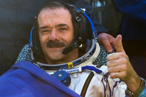 Canadian astronaut Chris Hadfield gestures after the Russian Soyuz space capsule landed some 150 km (90 miles) southeast of the town of Zhezkazgan, in central Kazakhstan