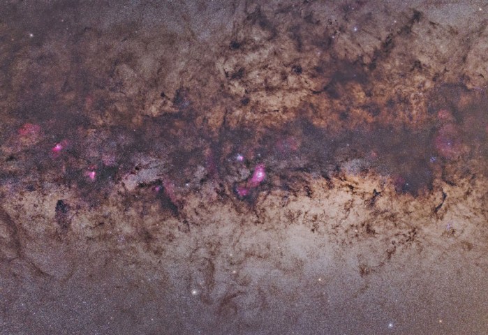 The "dark nebula" streamers where M8 and M20 are located. These are dust clouds located near the center of our galaxy, an area called the "central bulge". Image taken from Likely Place RV Resort in California, in Aug. 2013.