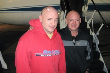 From left: Expedition 26 Commander Scott Kelly is reunited with his twin brother, Mark Kelly on March 17, 2010, following a flight back to Ellington Field, Houston from Kustanai, Kazakhstan.