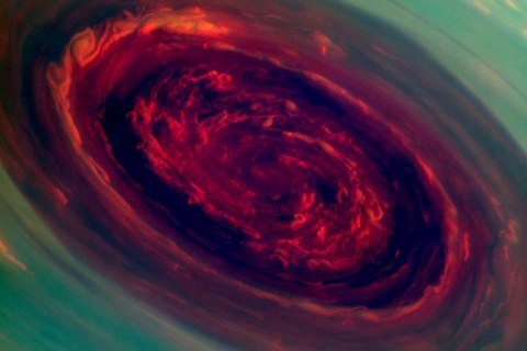The vortex of Saturn's north polar storm is seen in this false-color image taken from NASA's Cassini spacecraft. The eye is an estimated 1,250 miles across with cloud speeds as fast as 330 miles per hour.