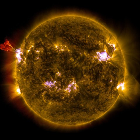 A burst of solar material leaps off the left side of the sun in what’s known as a prominence eruption.
