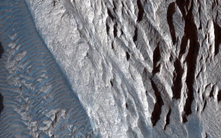Sandstone cliffs and hematite lag deposits of Ophir Mensa on Mars. 