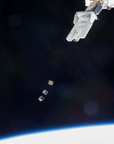 Three nanosatellites, known as Cubesats, are deployed on Nov. 19, 2013 from a Small Satellite Orbital Deployer (SSOD) attached to the Kibo laboratorys robotic arm on the International Space Station.