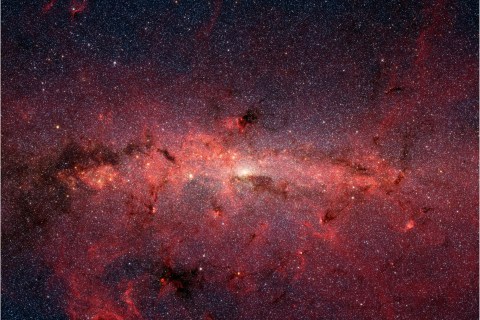 The Spitzer Space Telescope's infrared cameras reveals the stars of the crowded galactic center region of the Milky Way.