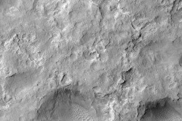 NASA's Curiosity Mars rover and tracks left by its driving appear in this portion of a Dec. 11, 2013