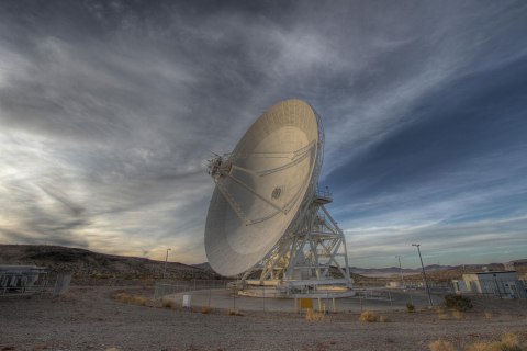 Goldstone's 111.5-foot (34-meter) Beam Waveguide tracks a spacecraft as it comes into view, in the Mojave Desert, California, on Jan. 11, 2012.