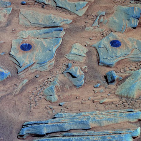 NASA's Mars Exploration Rover Spirit acquired this false-color image after using the rock abrasion tool to brush the surfaces of rock targets informally named "Stars" (left) and "Crawfords" (right).