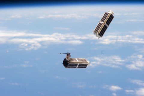 A set of NanoRacks CubeSats photographed by an Expedition 38 crew member after the deployment by the Small Satellite Orbital Deployer (SSOD).
